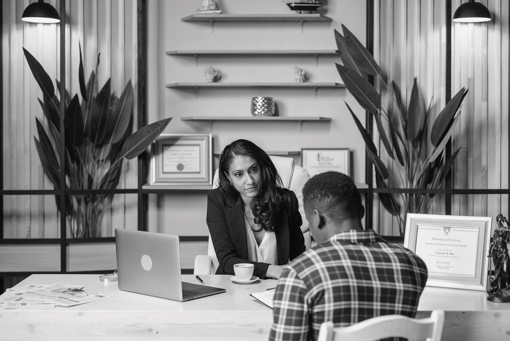 Female Lawyer looking at her Client 